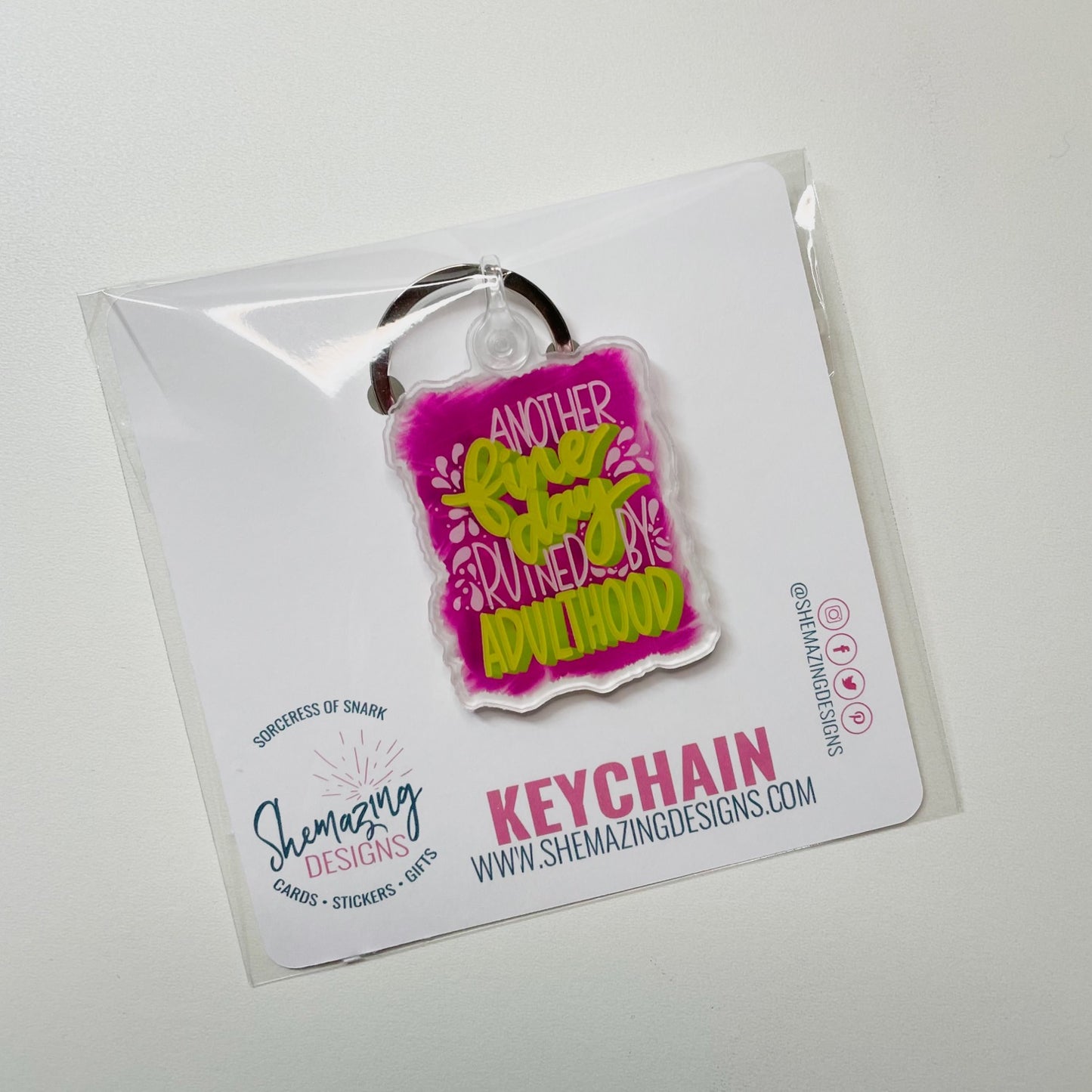 another fine day ruined by adulthood keychain in packaging